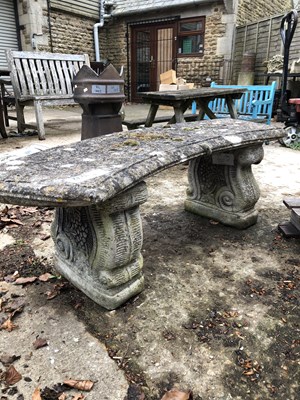 Lot 1272 - A curved reconstituted stone garden seat.