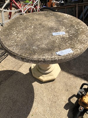 Lot 1280 - A stoneware garden table on column support.