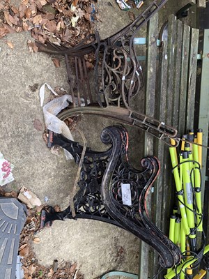 Lot 1294 - Three pairs of iron garden bench ends.