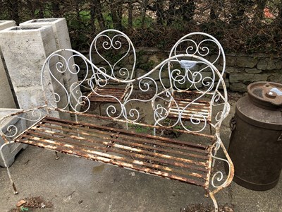 Lot 1314 - A wrought iron garden bench and two matching...