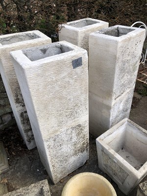 Lot 1321 - A set of four tall terrace planters of square...