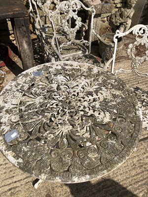 Lot 1322 - An alloy patio table and four matching chairs.