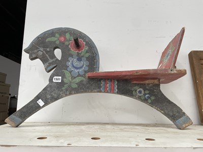 Lot 1501 - A child's floral painted sit on wooden horse