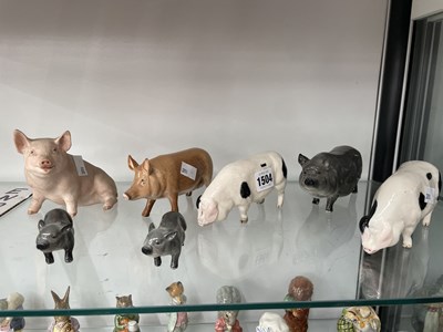 Lot 1504 - Five Doulton pigs together with two others by...