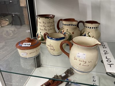 Lot 1510 - Five Torquay slip ware jugs together with a...