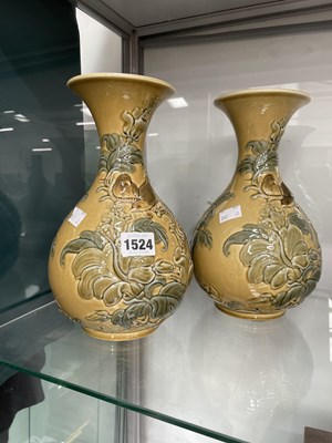 Lot 1524 - A pair of Lladro beige ground vases with...