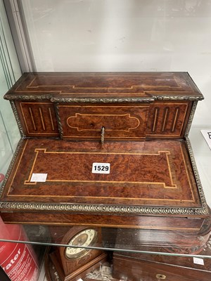 Lot 1529 - An ormolu mounted burr yew wood writing slope...