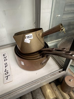Lot 1532 - A nest of five copper saucepans together with...