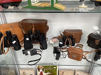 Lot 1553 - Five leather cased pairs of binoculars...