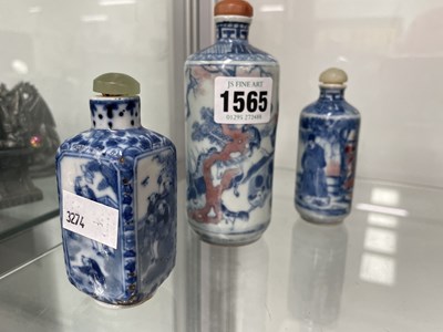Lot 1565 - Two Chinese underglaze blue and red snuff...