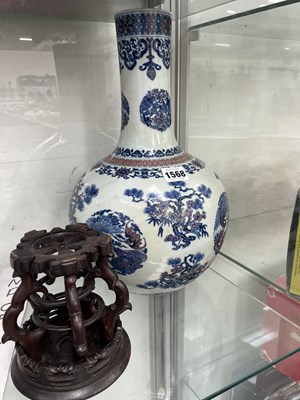Lot 1568 - A Chinese underglaze blue and red bottle vase...