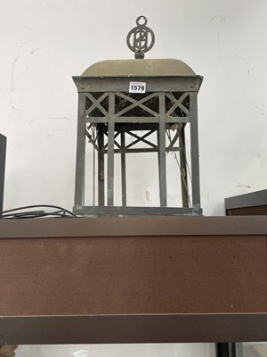 Lot 1579 - A meatl lantern, the domed top with a...