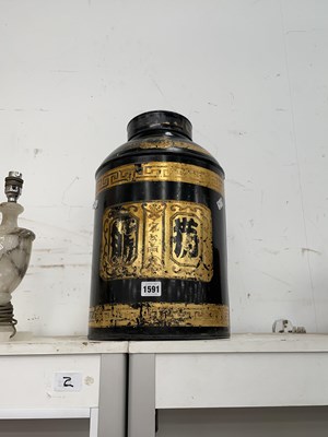 Lot 1591 - A black ground metal tea cannister with gilt...