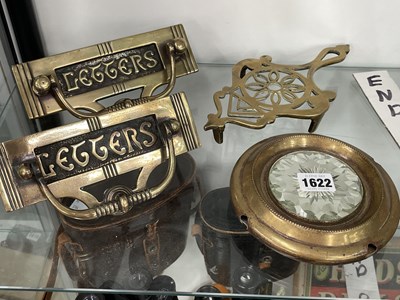Lot 1622 - Two brass letter box door knockers, a trivet...
