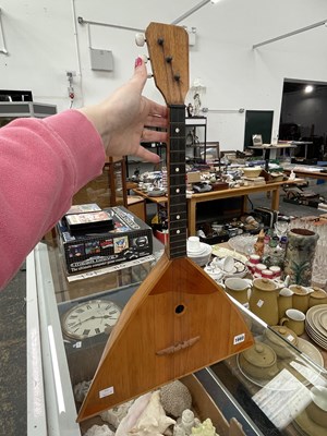 Lot 1660 - An inlaid wood three string balalaika