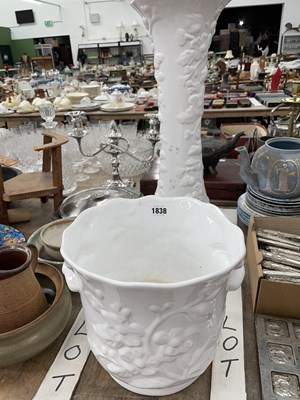Lot 1838 - A flower moulded white glazed planter and stand