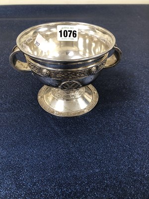 Lot 1076 - A hallmarked silver heavy two-handled chalice...