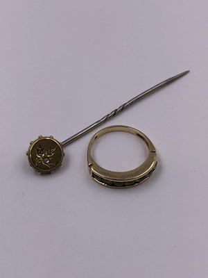 Lot 1015 - A 9ct hallmarked gold peridot channel set half...