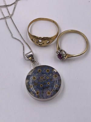 Lot 1016 - A 9ct, hallmarked gold ruby and diamond...
