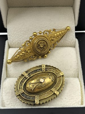 Lot 1018 - Two antique 15ct  stamped brooches, one with a...