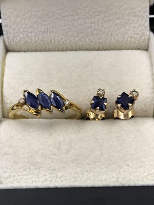 Lot 1032 - A gemset ring and pair of stud earrings. Both...