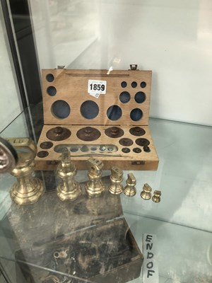 Lot 1859 - A boxed set of copper gram weights together...