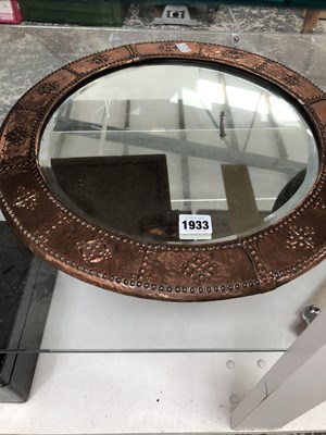 Lot 1933 - An Arts and Crafts copper framed circular mirror