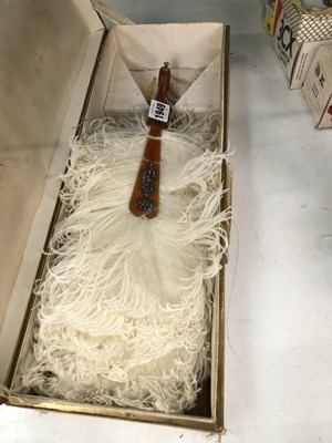 Lot 1949 - A boxed white ostrich feather fan, the faux...