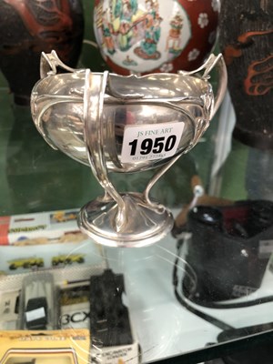 Lot 1950 - An Art Nouveau Chester silver three handled...