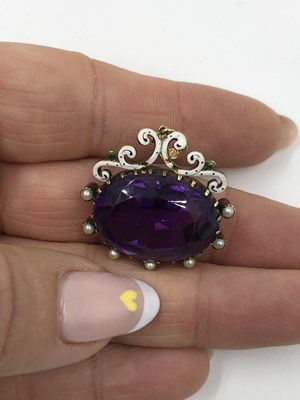 Lot 1061 - An antique gemset and enamel pendant in the...