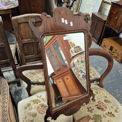 Lot 2282 - A Georgian walnut fret framed wall mirror.