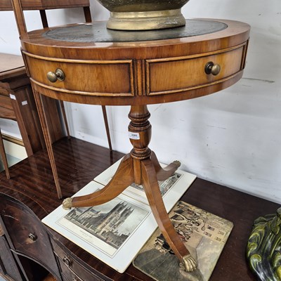 Lot 2285 - A drumtop occasional table.