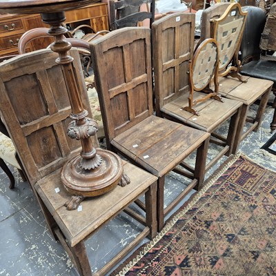 Lot 2296 - A set of four panel back hall chairs.