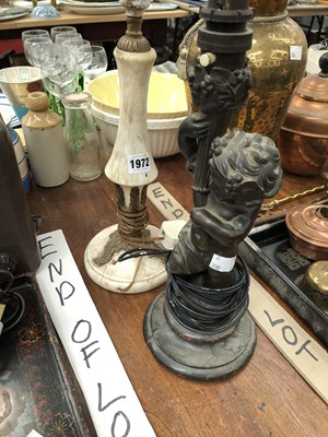 Lot 1972 - A bronze child holding a torch as a table lamp...