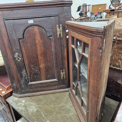 Lot 2324 - Two oak corner cabinets.