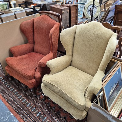 Lot 2347 - A pair of Georgian-style wingback armchairs. H...