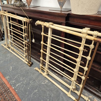 Lot 2350 - A pair of iron and brass single bed ends.