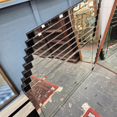 Lot 2353 - A large modern wall mirror with stepped framing.