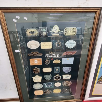 Lot 2365 - A glazed display of champagne labels.