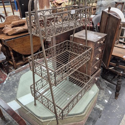 Lot 2420 - A wrought iron three-tier stand.