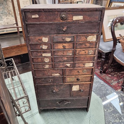 Lot 2421 - Two vintage nests of small collectors' drawers.
