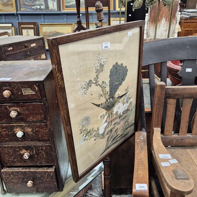 Lot 2422 - An antique pole screen with an oriental...