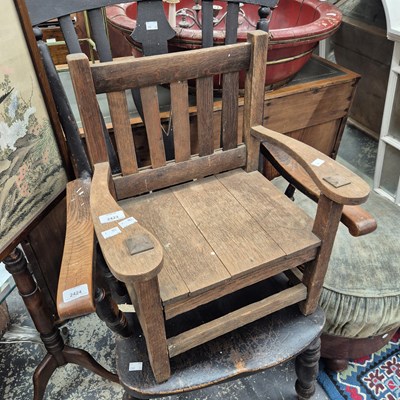 Lot 2423 - An arts and crafts style oak child's chair.
