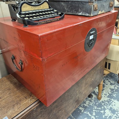 Lot 2467 - An oriental red lacquer trunk. H 39 x W 77 X D...