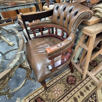 Lot 2507 - A button back office armchair.
