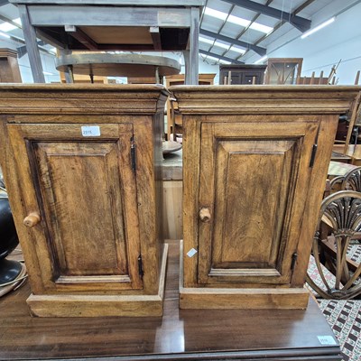 Lot 2515 - A pair of hardwood bedside cabinets.