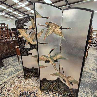 Lot 2548 - An oriental lacquer four fold screen.