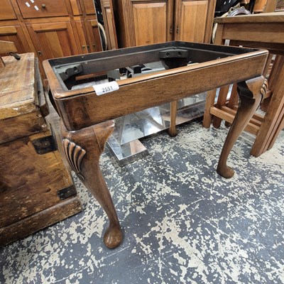 Lot 2551 - A walnut dressing stool.