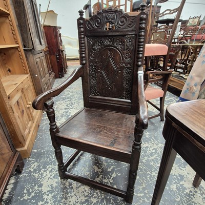 Lot 2560 - An antique carved oak high-back Wainscott-type...