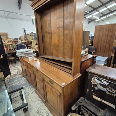 Lot 2590 - An oak bookcase on a cabinet. Open bookcase...